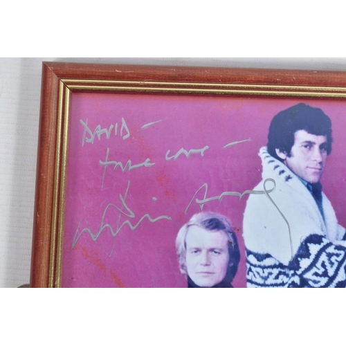 212 - A COLLECTION OF FRAMED SIGNED PHOTOGRAPHS, to include David Soul on a Starsky and Hutch print, Rober... 