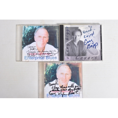 220 - A COLLECTION OF SIGNED CDs AND DVDs, to include three CDs which are signed by Casey Biggs and Vaughn... 