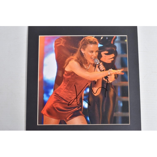 221 - TWO SIGNED MADONNA PHOTOGRAPHS, AND ONE KYLIE MINOGUE, all signed in black marker, fitted in card fr... 