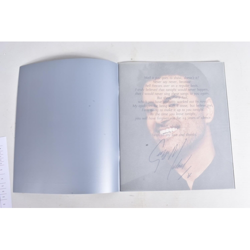 225 - A SIGNED 25LIVE GEORGE MICHAEL PROGRAMME, 35cm x 30cm, signed to the front blue panel