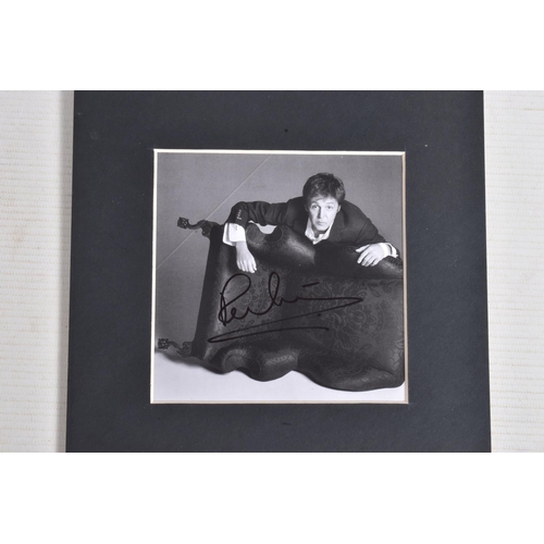 227 - A SINGED PICTURE OF PAUL MCCARTNEY, approximately 11cm square, black and white photo, signature in b... 