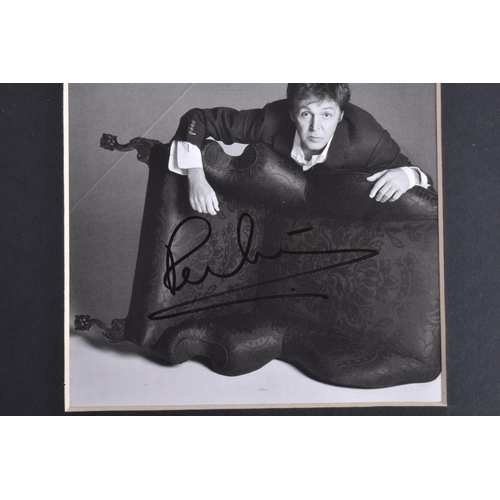 227 - A SINGED PICTURE OF PAUL MCCARTNEY, approximately 11cm square, black and white photo, signature in b... 