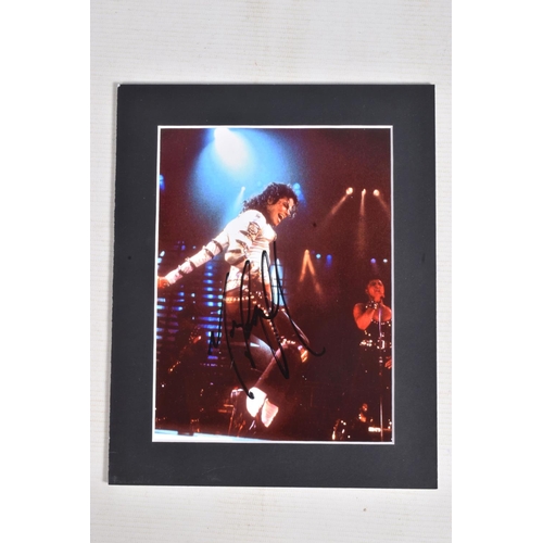 231 - TWO SIGNED PHOTOGRAPHS OF MICHAEL JACKSON, one is framed with a mat 12   x 10   signed in black mark... 