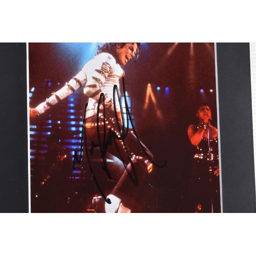 231 - TWO SIGNED PHOTOGRAPHS OF MICHAEL JACKSON, one is framed with a mat 12   x 10   signed in black mark... 