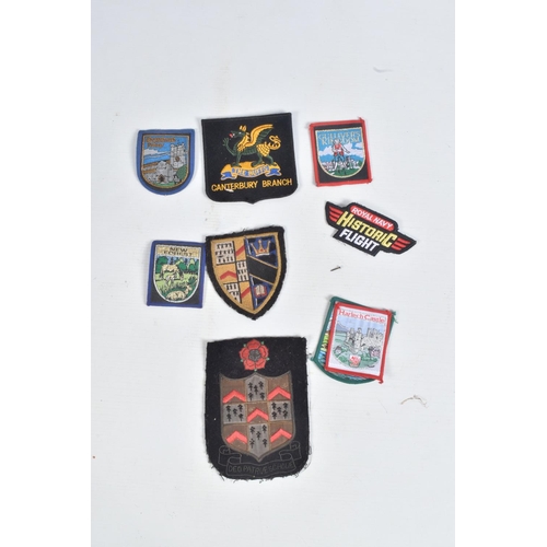 238 - A COLLECTION OF MILITARY ITEMS, to include uniform, buttons, cap badges, etc, the uniforms include a... 