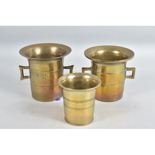 240 - A COLLECTION OF TRENCH ART, to include Loving Cups, beaker, planter and shells, the loving cups have... 