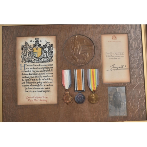 242 - A WWI FRAMED CASUALTY GROUP OF MEDALS, these include a 1914/15 Trio of medals, memorial plaque scrol... 