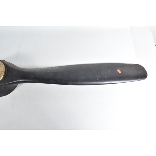 243 - A WOODEN AEROPLANE PROPELLER WITH A BAROMETER IN THE CENTRE, there are no visible markings or number... 