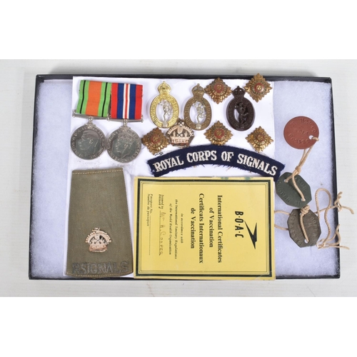 253 - A RIKER MOUNT DISPLAY CASE, containing WW2 War & Defence Medal, Insignia and badges including Dog Ta... 