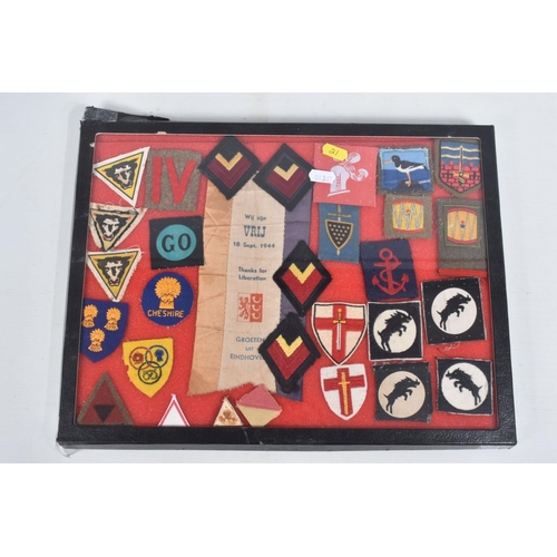 264 - RIKER DISPLAY CASE CONTAINING VARIOUS FORMATION PATCHES & INSIGNIA with an Operation Market Garden i... 