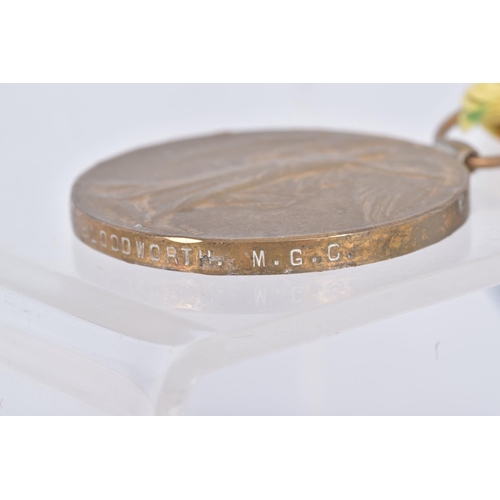 272 - A PAIR OF WWI MEDALS NAMED TO PRIVATE T.W. BLOODWORTH ADN AN ICE BUCKET, the medals are mounted for ... 