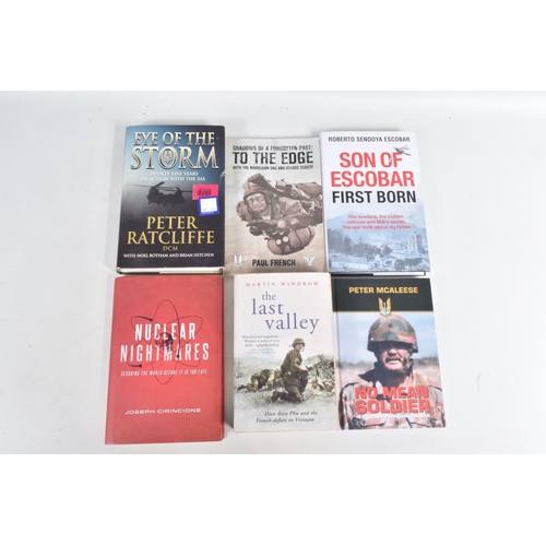 285 - A BOX OF MILITARY RELATED BOOKS BOTH HARD & SOFTBACK, together with four signed photos by Peter McAl... 