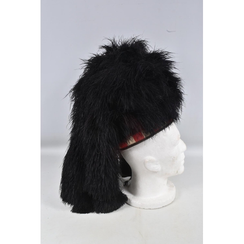 288 - A VINTAGE SCOTTISH MILITARY BUSBY HAT, this is black with a Royal Highlanders Black Watch badge on t... 