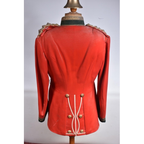 289 - A DEVONSHIRE REGIMENT RED MILITARY TUNIC, this has Devonshire buttons and collar badges and the insi... 