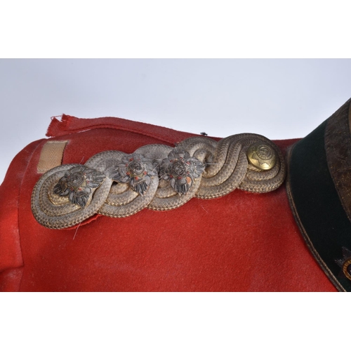 289 - A DEVONSHIRE REGIMENT RED MILITARY TUNIC, this has Devonshire buttons and collar badges and the insi... 