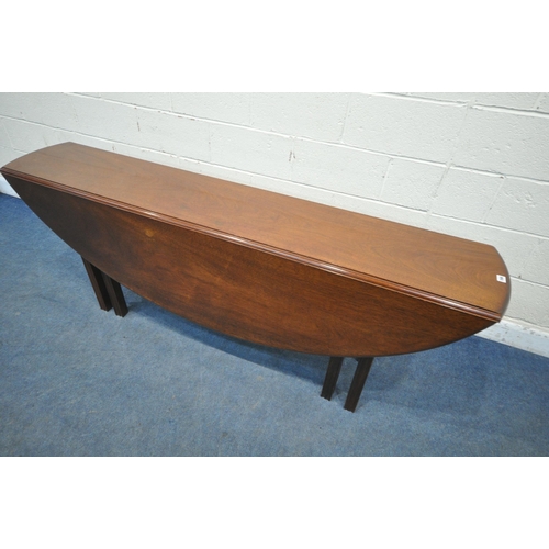 166 - A REPRODUCTION MAHOGANY GATE LEG WAKE TABLE, that opens to an oval, on eight reeded legs, length 198... 