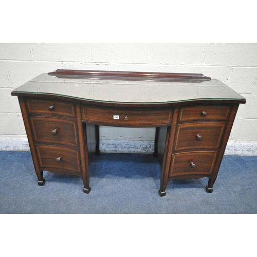 167 - AN EDWARDIAN MAHOGANY SERPENTINE DESK, with an arrangement of seven drawers, on square tapered legs ... 