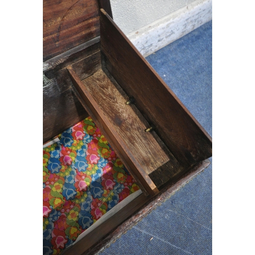 180 - A BRASS-STUDDED TEAK OR HARDWOOD ZANZIBAR CHEST, early 20th century, embossed brass detail, drop han... 