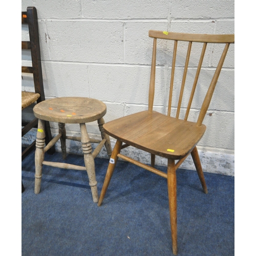 186 - AN ERCOL BLONDE ELM ALL PURPOSE CHAIR, elm stool, three other chairs, oval mirror and two ceramic ta... 