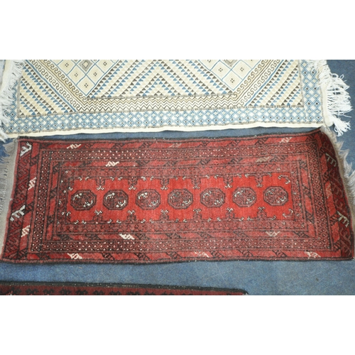 189 - A RED GROUND RECTANGULAR RUG, with sixteen medallions, surrounded by a multi-strap border, 142cm x 9... 