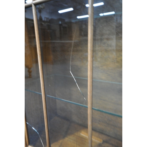 200 - A 20TH CENTURY WALNUT DISPLAY CABINET, the double glazed doors enclosing four glass shelves, raised ... 