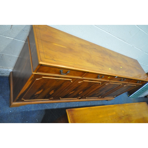 203 - A LATE 20TH CENTURY YEW WOOD SIDEBOARD, fitted with four drawers, above four cupboard doors, width 1... 