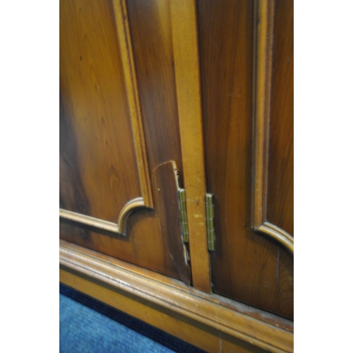 203 - A LATE 20TH CENTURY YEW WOOD SIDEBOARD, fitted with four drawers, above four cupboard doors, width 1... 