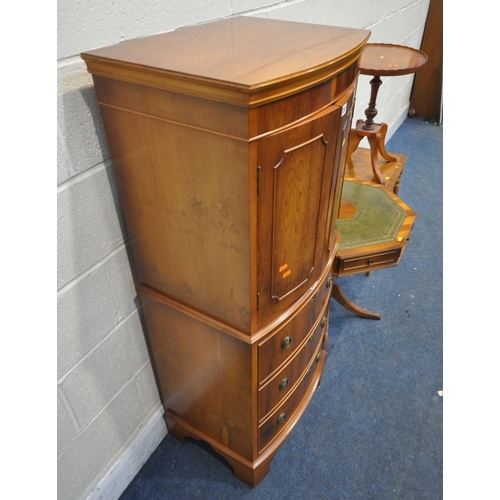 207 - A SELECTION OF YEW WOOD OCCASIONAL FURNITURE, to include a cabinet, with double cupboard doors, abov... 