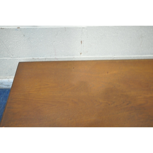 211 - POSSIBLY TREVOR CHINN FOR GORDON RUSSELL, A MID CENTURY TEAK COFFEE TABLE, raised on square tapered ... 