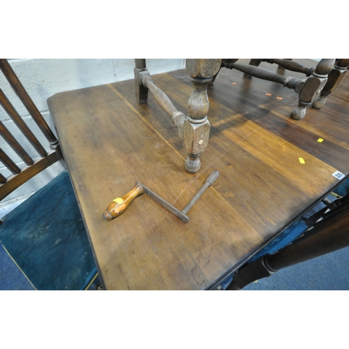 225 - A 20TH CENTURY WIND OUT DINING TABLE, with one additional leaf, raised on reeded legs, with later ca... 