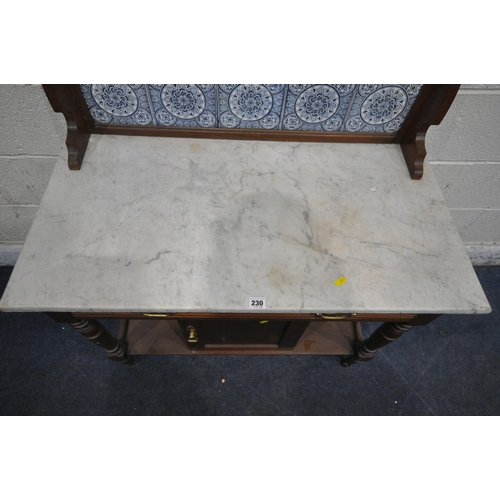 230 - A 20TH CENTURY MARBLE TOP WASH STAND, with a raised tile back, a single drawer, above a cupboard doo... 