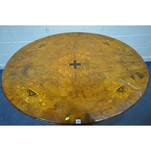 232 - A 20TH CENTURY BURR WALNUT OVAL TILT TOP TABLE, raised on a base with four pillars, and four scrolle... 