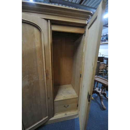 251 - A 19TH CENTURY PINE TRIPLE DOOR WARDROBE, with an overhanging, the right hand door enclosing various... 