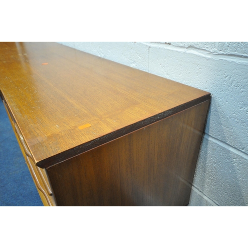 253 - POSSIBLY JENTIQUE, A MID CENTURY TEAK SIDEBOARD, fitted with double cupboard doors, and three drawer... 