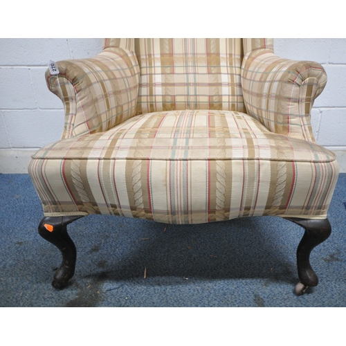 270 - A GEORGIAN MAHOGANY WING BACK ARMCHAIR, upholstered in tartan upholstery, on cabriole front legs and... 