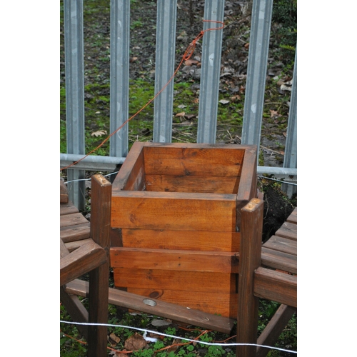 3 - A MODERN WOODEN GARDEN CORNER SEAT, with an angled centre (not fully fixed together) along with a sq... 