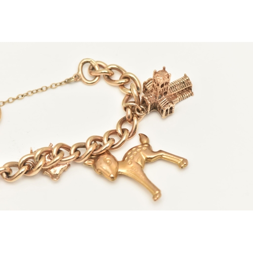 402 - A 9CT GOLD CHARM BRACELET, a yellow gold curb link bracelet, fitted with a heart padlock clasp, hall... 