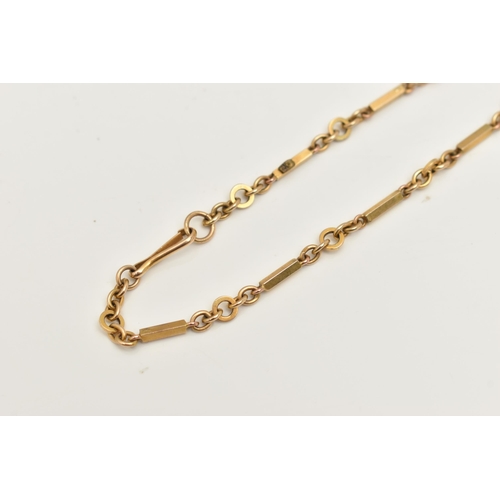 407 - A YELLOW METAL BRACELET, a fancy link bracelet fitted with a lobster clasp, approximate length 180mm... 