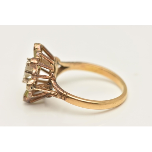 416 - A YELLOW METAL DIAMOND CLUSTER RING, a principally set round brilliant cut diamond, approximate tota... 