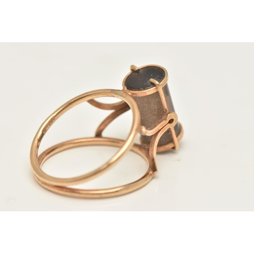 418 - A 9CT GOLD DRESS RING, an abstract design open work ring set with a cylinder cut smoky quartz, hallm... 