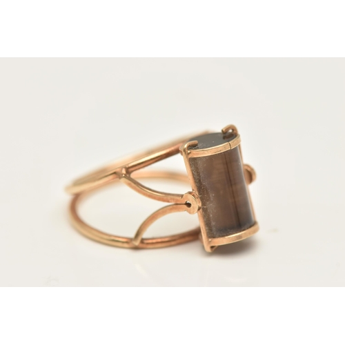 418 - A 9CT GOLD DRESS RING, an abstract design open work ring set with a cylinder cut smoky quartz, hallm... 