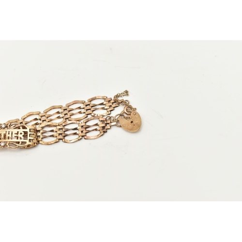 426 - A 9CT GOLD GATE NAME BRACELET, a yellow gold gate bracelet, fitted with a central panel with the nam... 