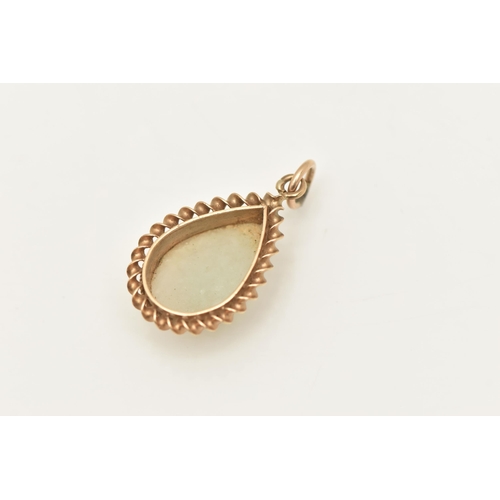 430 - A 9CT GOLD JADE PENDANT, of a pear drop shape, set with a pear cut jade cabochon, collet set within ... 