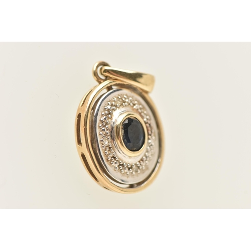 432 - A 9CT GOLD SAPPHIRE AND DIAMOND PENDANT, of an oval form, set with an oval cut deep blue sapphire ce... 