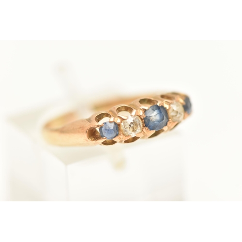 446 - A YELLOW METAL SAPPHIRE AND DIAMOND RING, set an oval cut and two small circular cut blue sapphires,... 