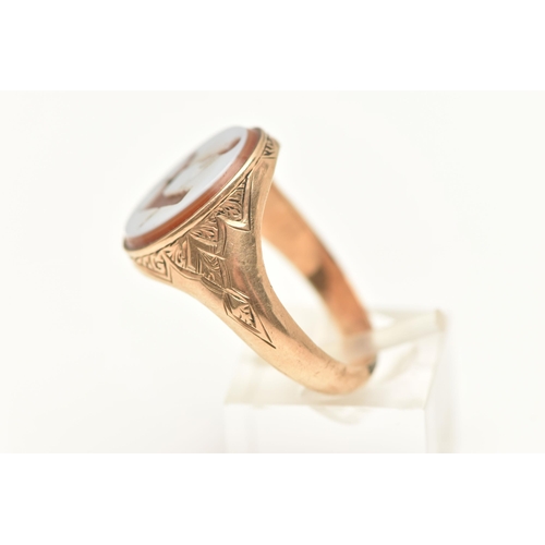 447 - A GENTS 9CT GOLD, MASONIC SIGNET RING, of an oval form, set with a carved sardonyx inlay depicting t... 