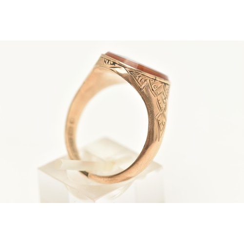 447 - A GENTS 9CT GOLD, MASONIC SIGNET RING, of an oval form, set with a carved sardonyx inlay depicting t... 