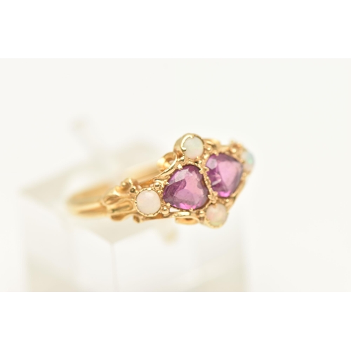 448 - A YELLOW METAL AMETHYST AND OPAL RING, set with two heart cut amethysts and four small opal cabochon... 