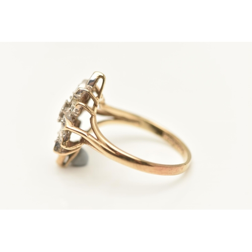 452 - A 9CT GOLD DIAMOND DRESS RING, floral cluster of single cut diamonds, each illusion set, to the trif... 