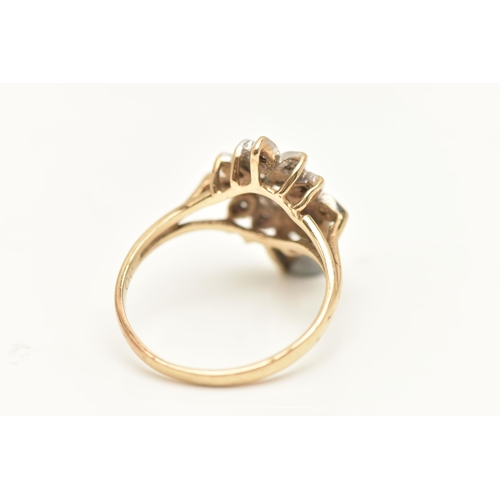 452 - A 9CT GOLD DIAMOND DRESS RING, floral cluster of single cut diamonds, each illusion set, to the trif... 